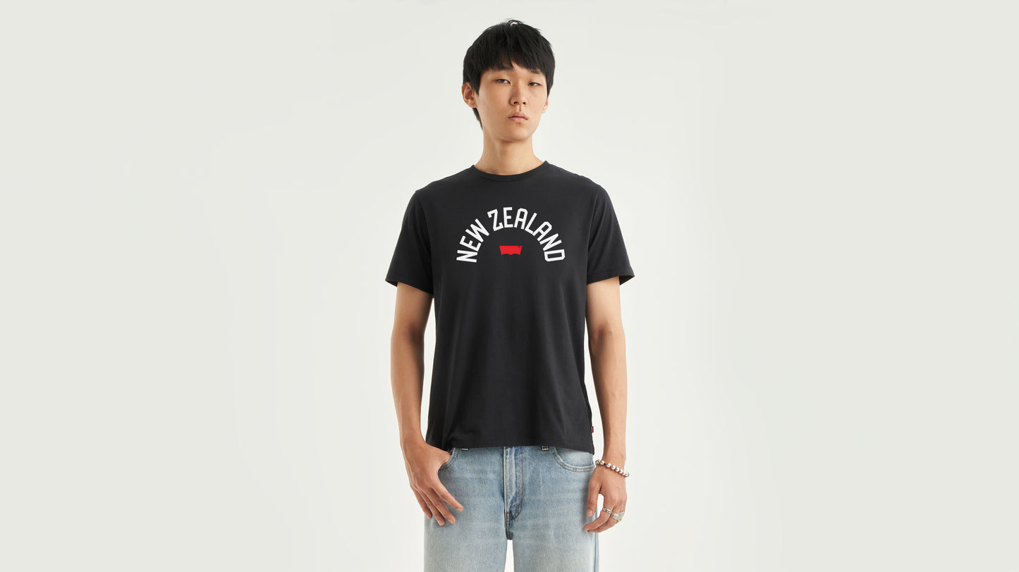 Man in Levi's NZ black tee with light-wash jeans