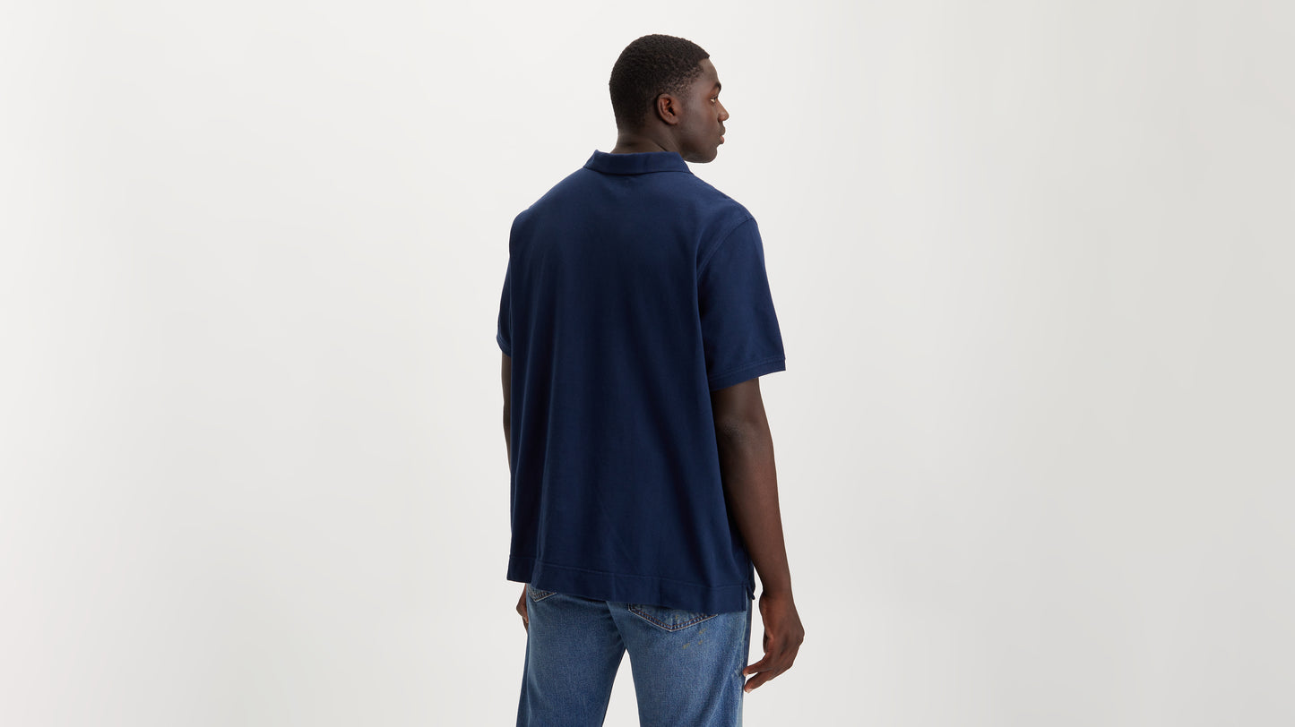 Man in Levi's blue polo shirt, back view