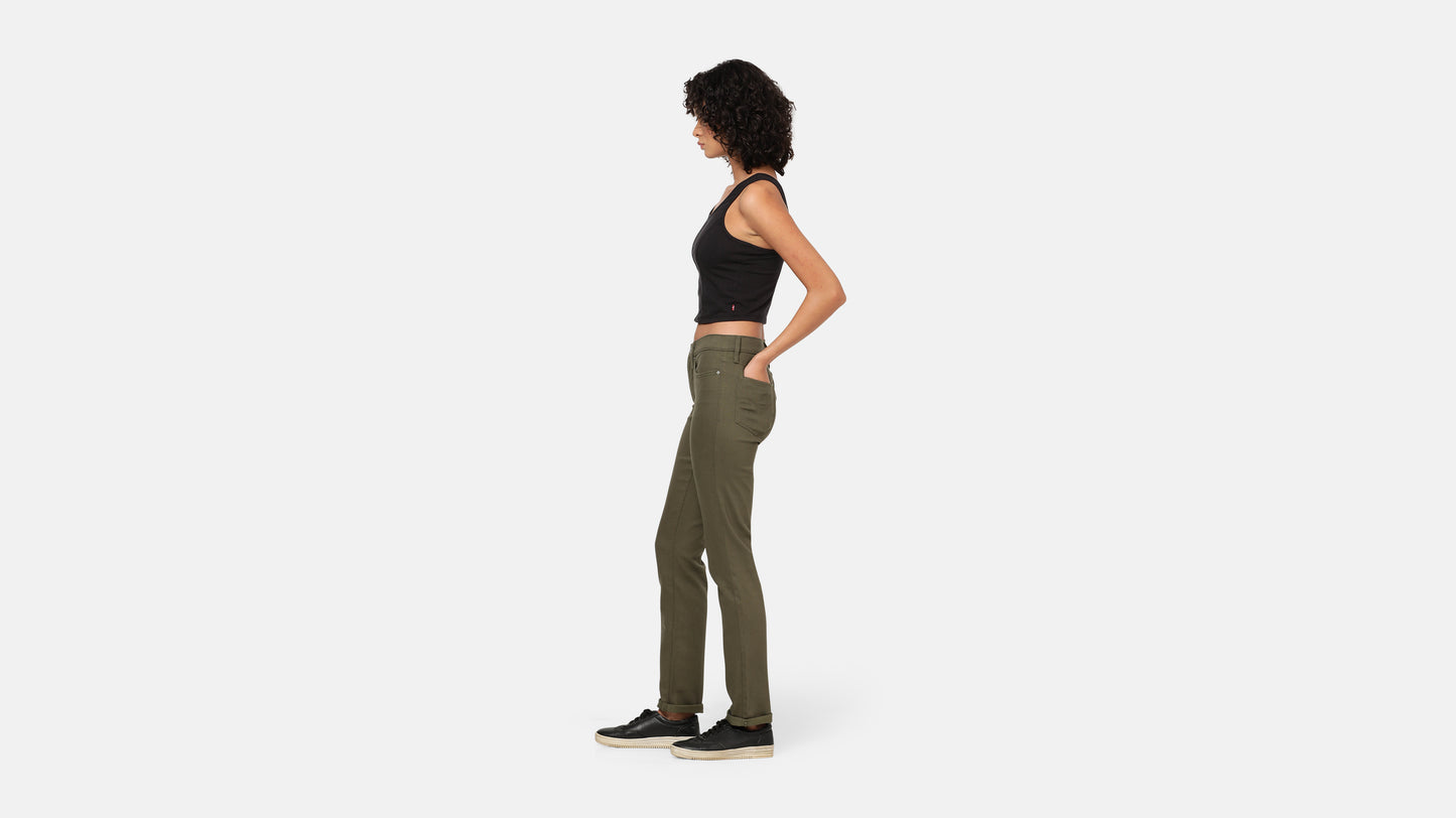 Woman in Olive green jeans black tank side profile