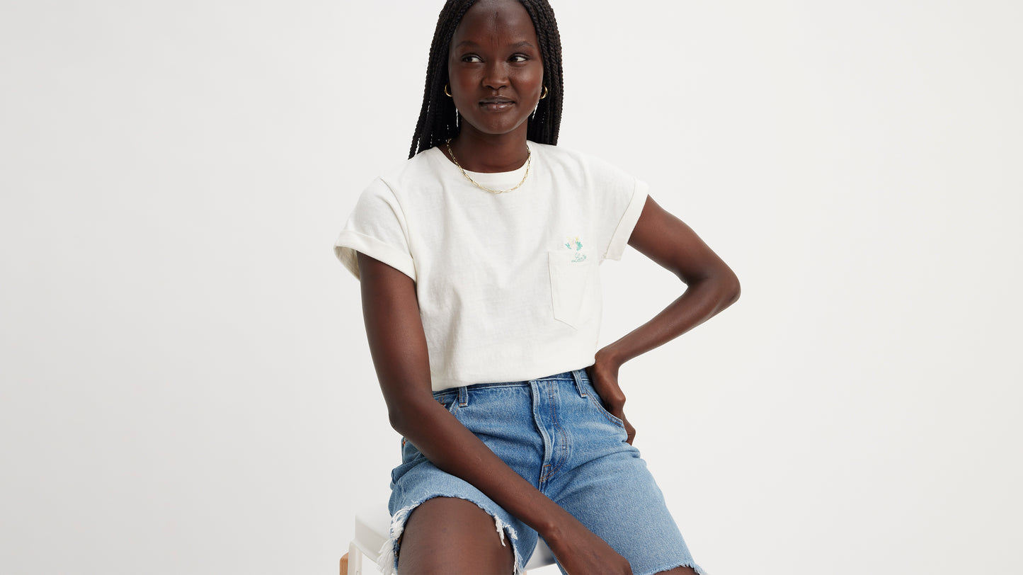 Woman in Levi's white graphic pocket shirt