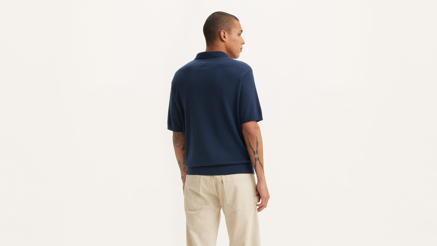 Back view of man in blue Levi's sweater knit polo