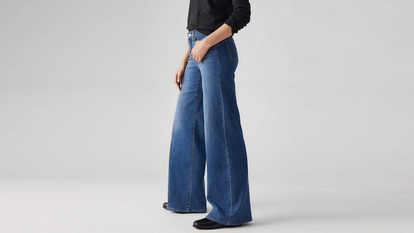 Model wearing Levi's women's jeans, close-up side view