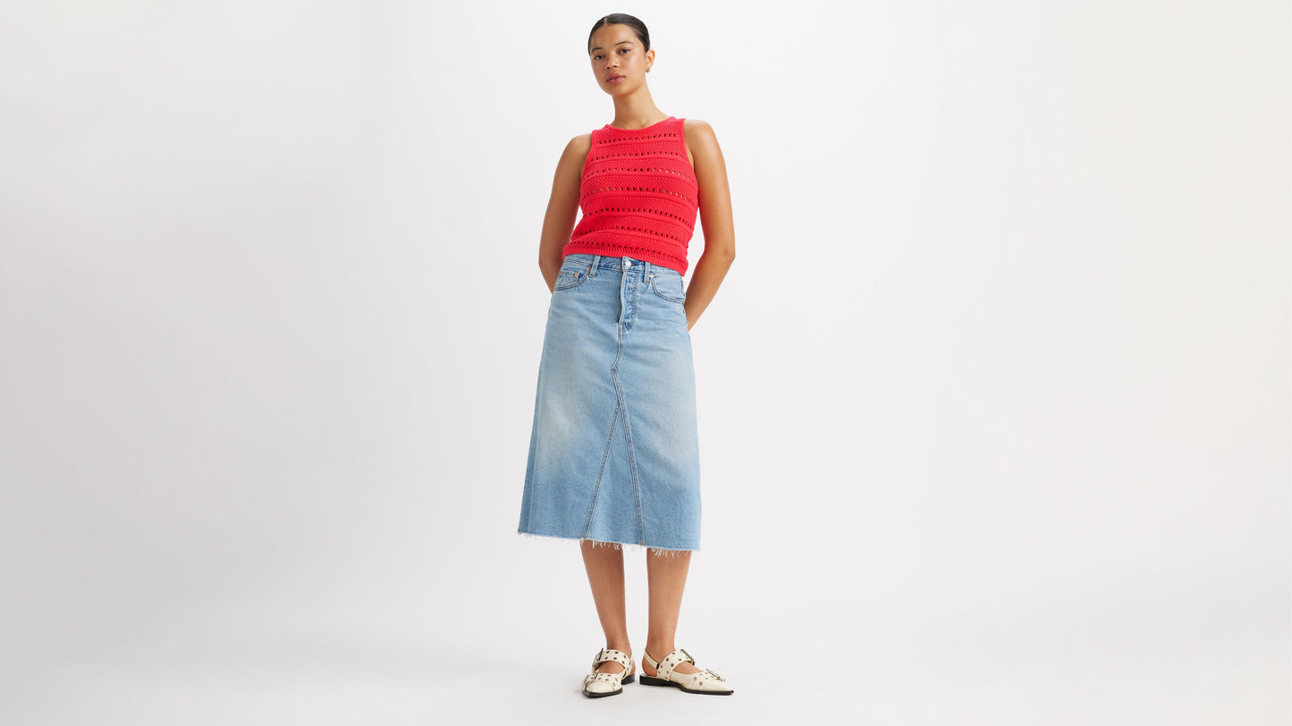 Woman in Levi's high-rise a-line skirt and red top