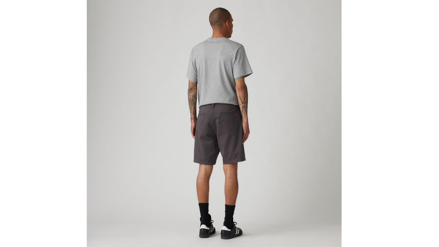 Back view of man in dark grey short and grey tee