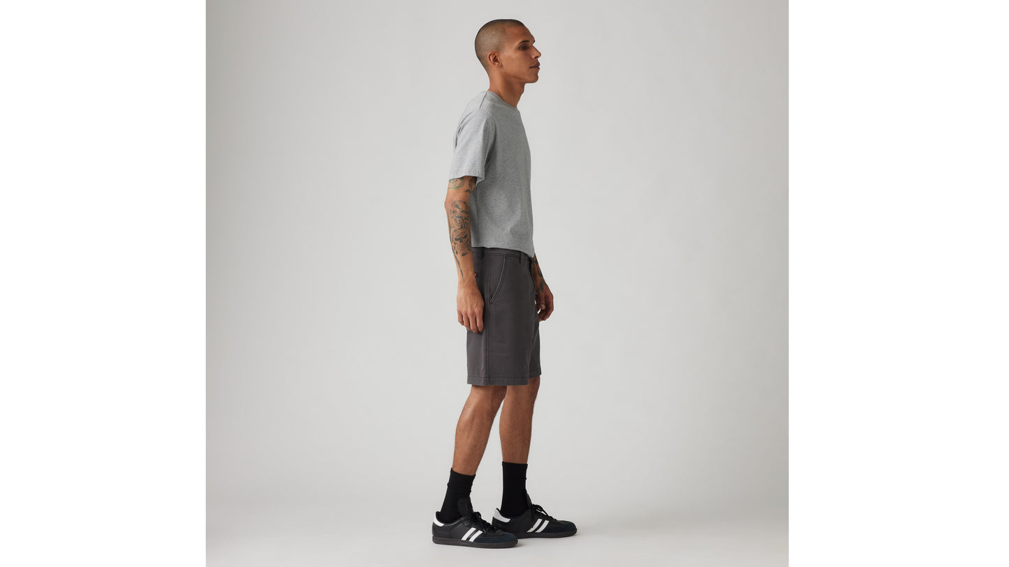 Man in charcoal Levi's shorts and grey tee
