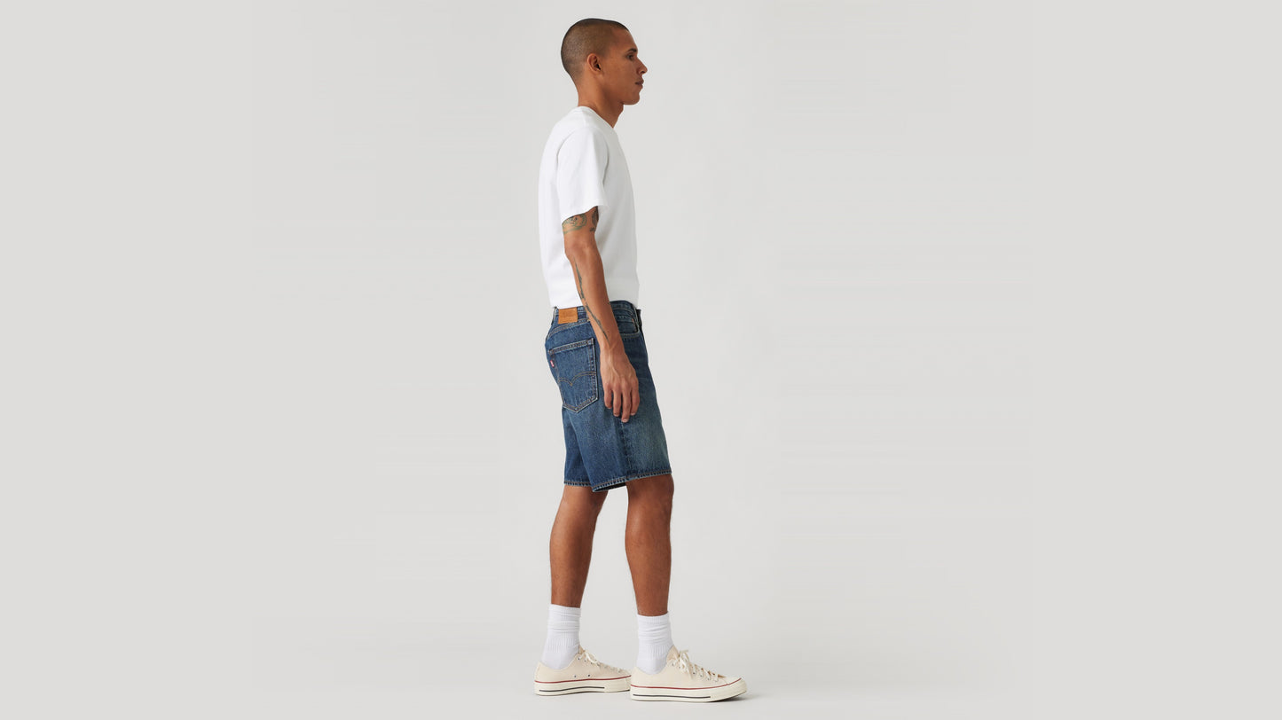Side view of man in Levi's denim shorts