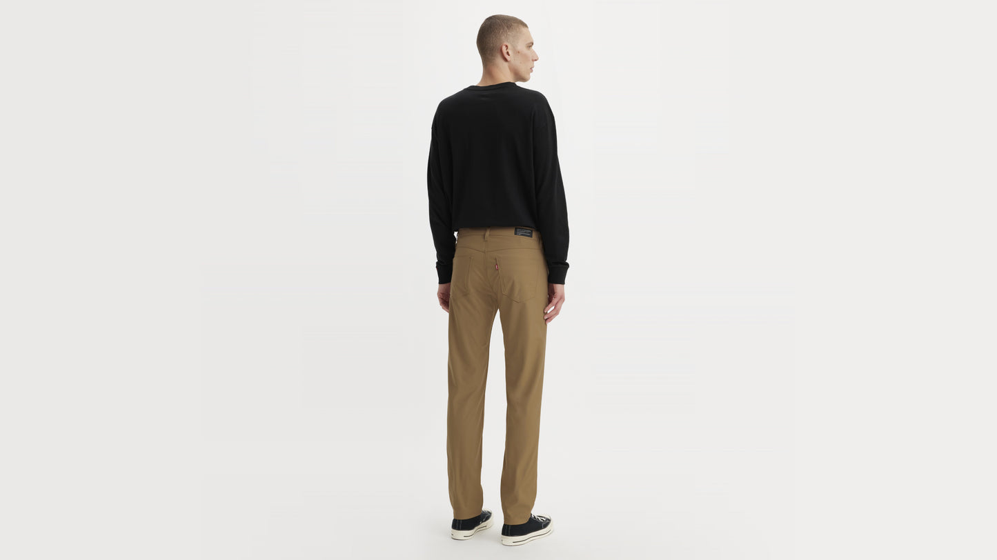 Man in brown straight-leg pants, back view