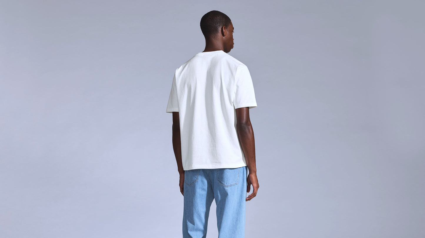 White Levi's t-shirt with light blue denim jeans