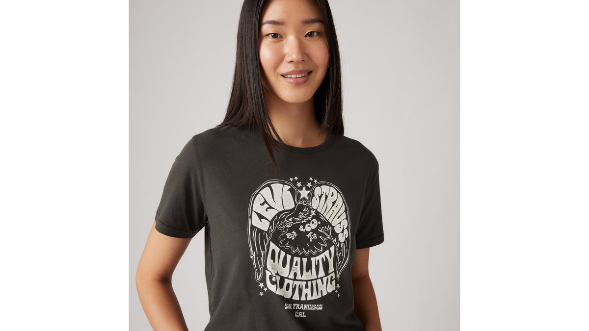 Close-up of woman in Levi's graphic black tee