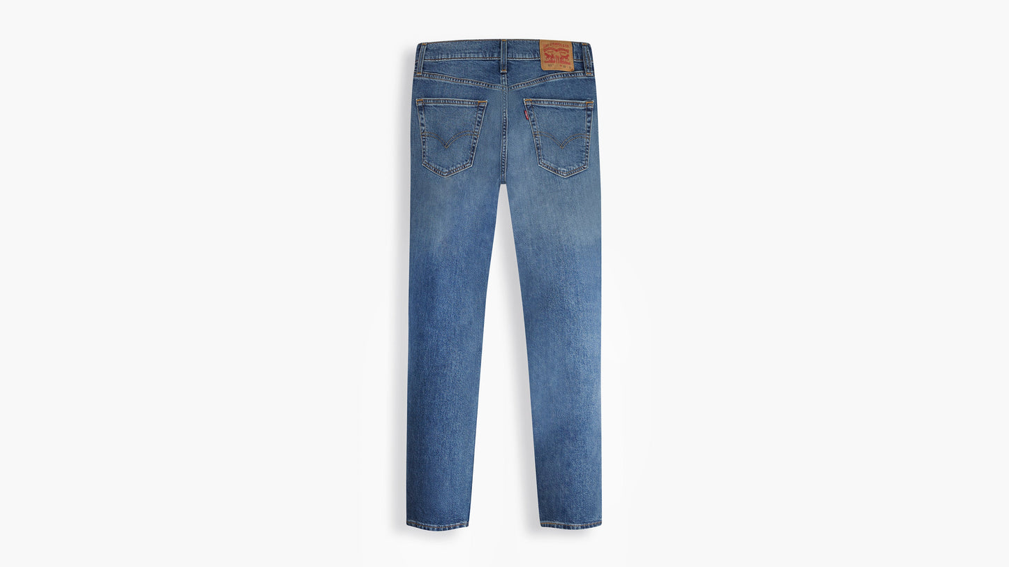 Back view of Levi’s 511 Slim Jeans in faded blue with leather patch & arcuate stitching