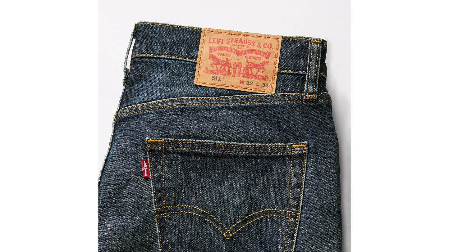 Close-up back view of dark wash Levi’s 511 jeans showing the leather patch & pocket