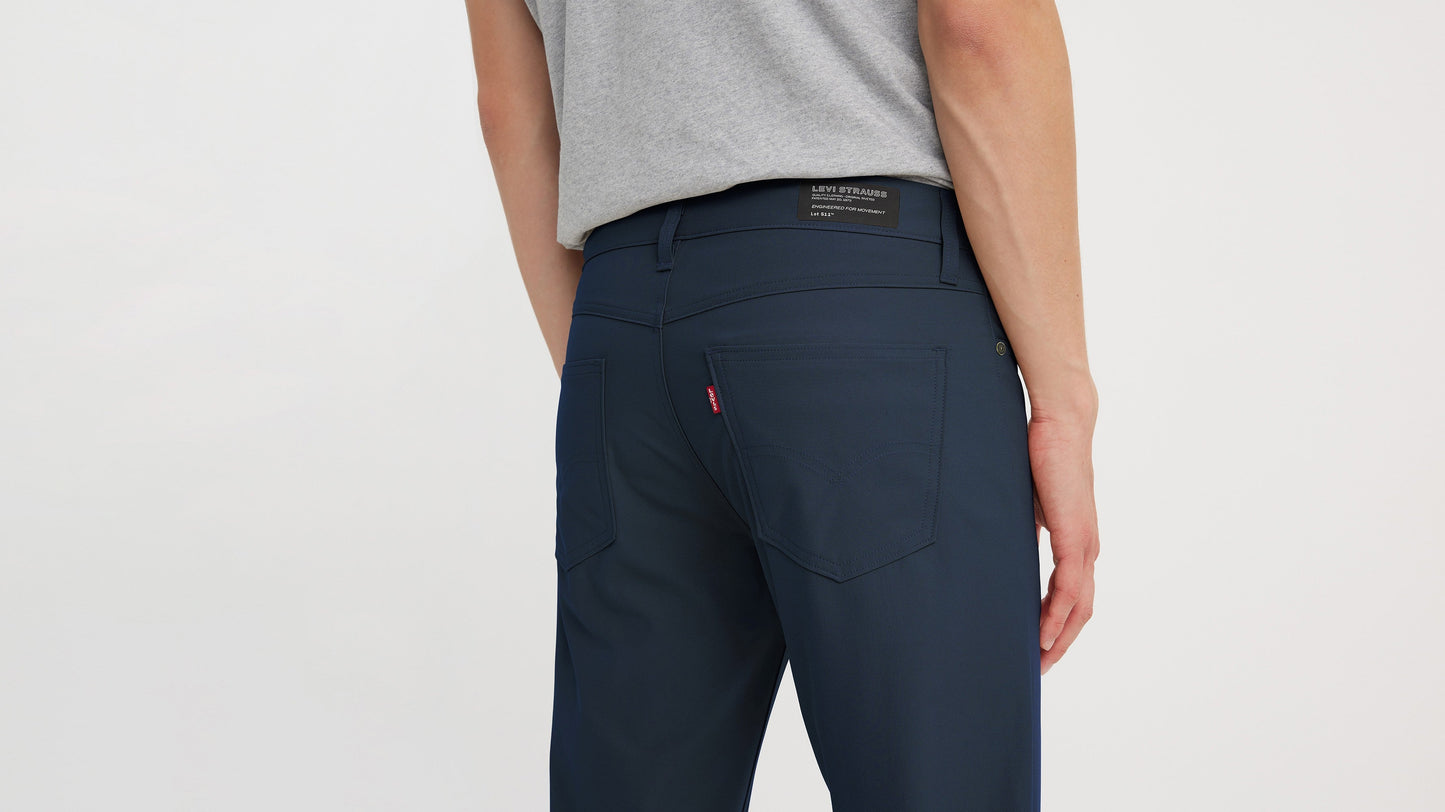 Close-up of Levi’s slim tech pants with logo patch and red tab