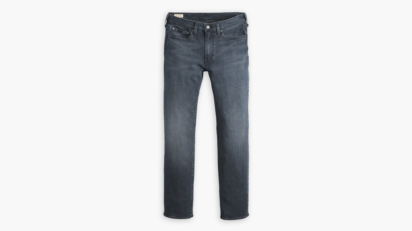 Flat lay of classic dark indigo Levi’s514 jeans with a straight-leg cut and clean fading