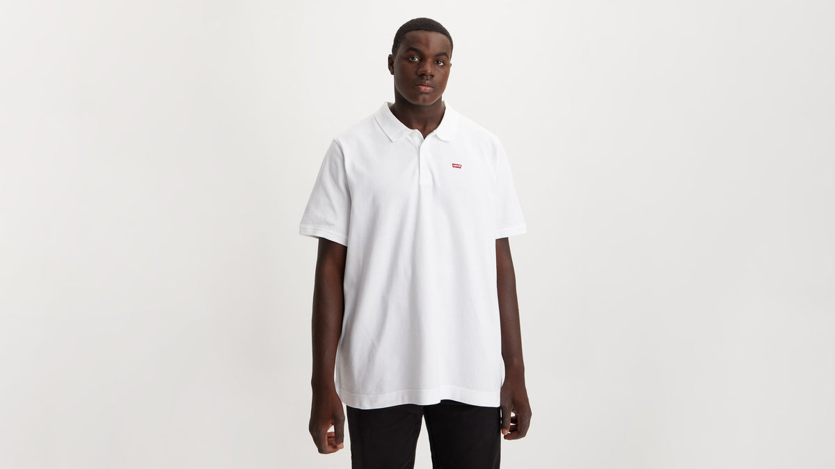 Man wearing Levi's white housemark polo shirt