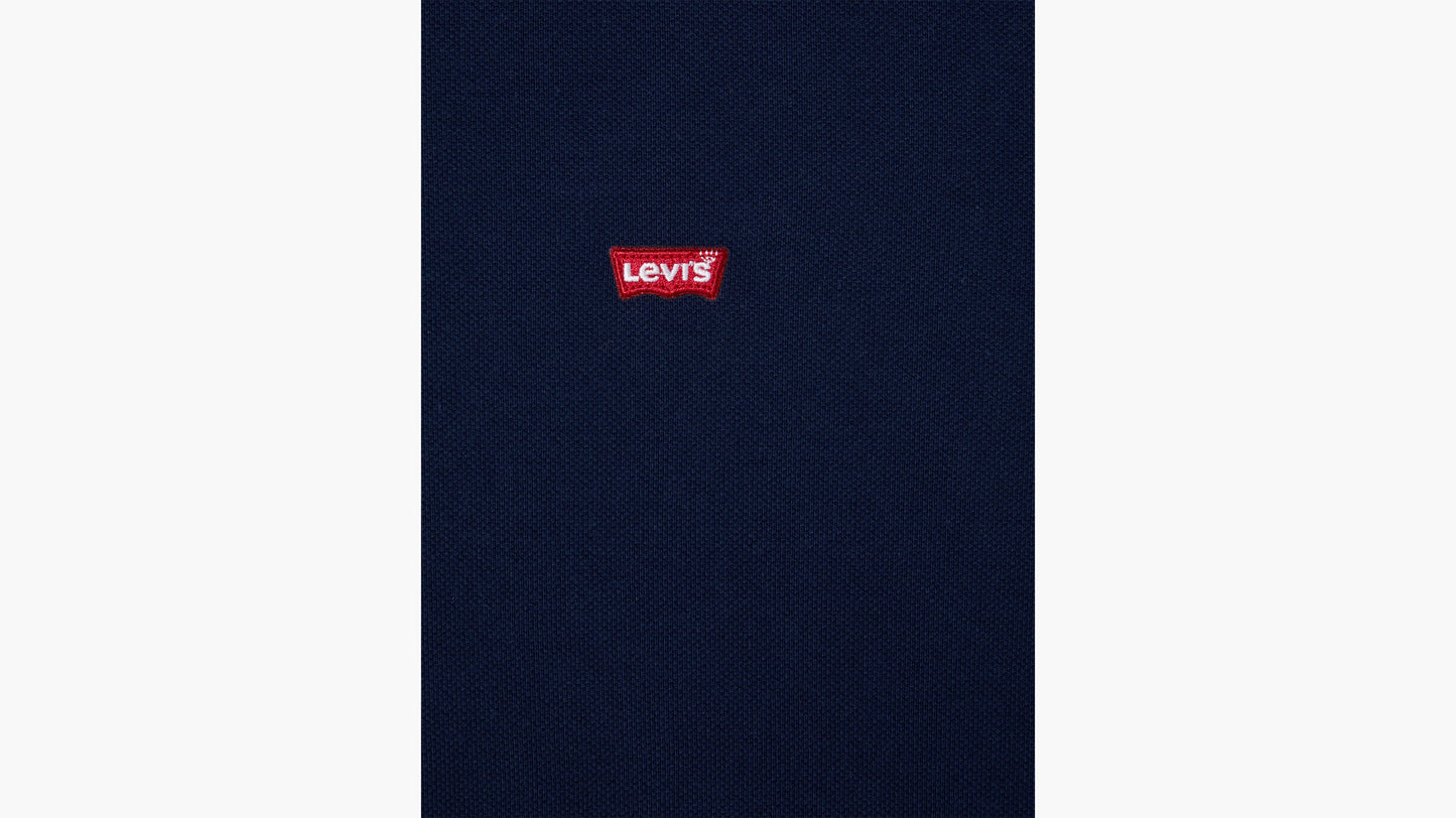 Close-up of Levi’s red logo on navy blue fabric