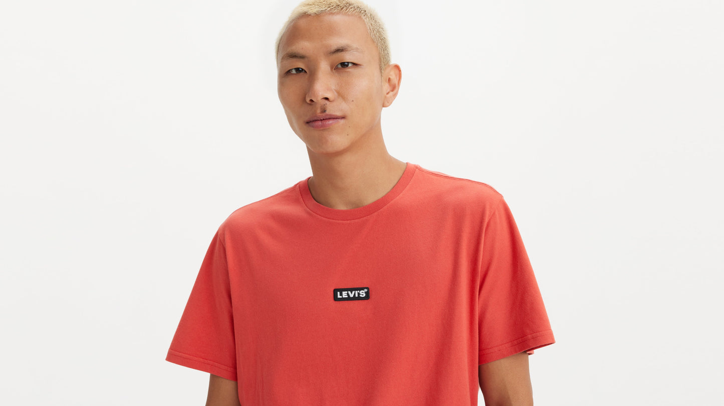 Man in Levi’s red short sleeve tee with logo patch