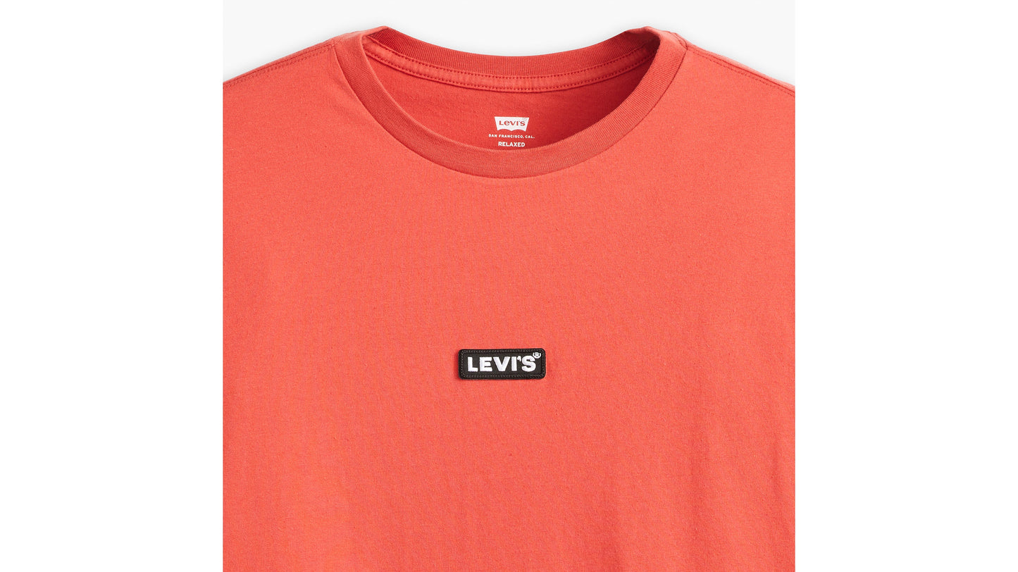 Close-up of Levi’s red T-shirt with black logo patch