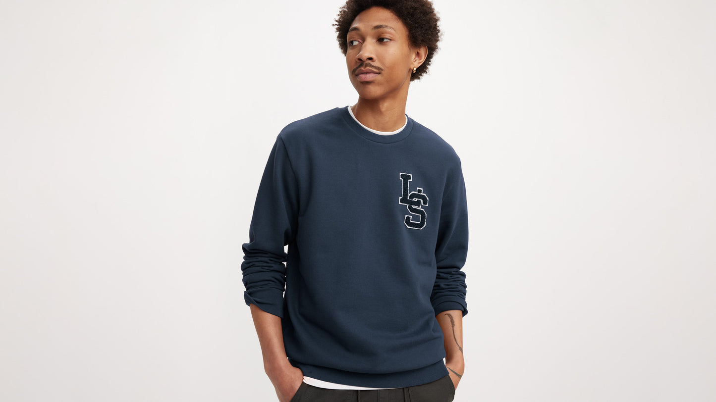 Man wearing navy Levi’s crewneck with LS patch
