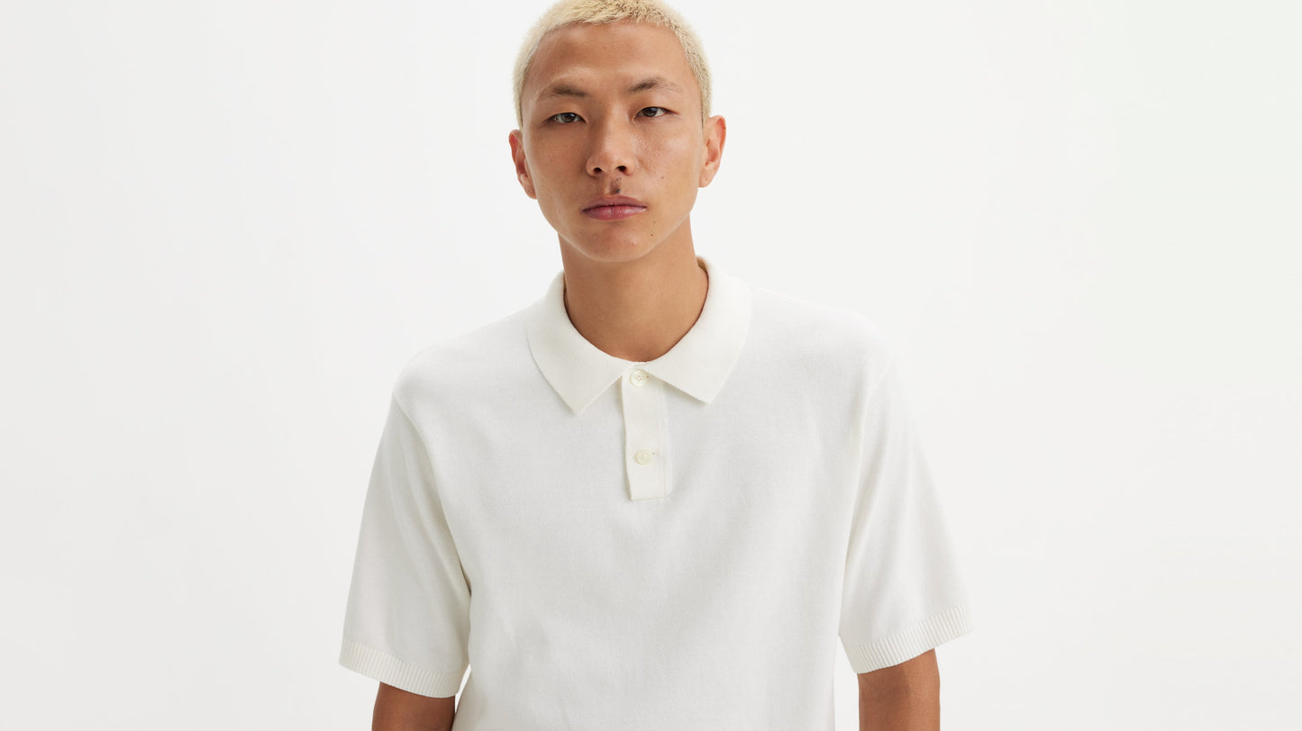 Close-up front viewof man wearing white Levi's knit polo shirt