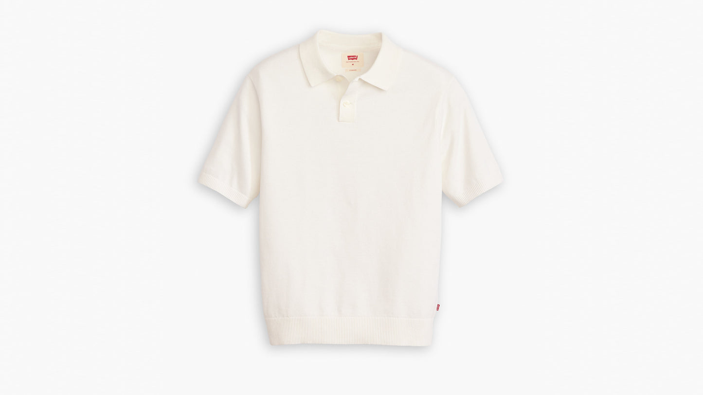 Flat lay of short-sleeve white knit polo shirt with button collar