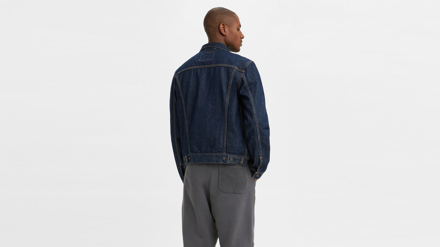 Model in Levi’s men’s Trucker Jacket in dark wash denim, back view