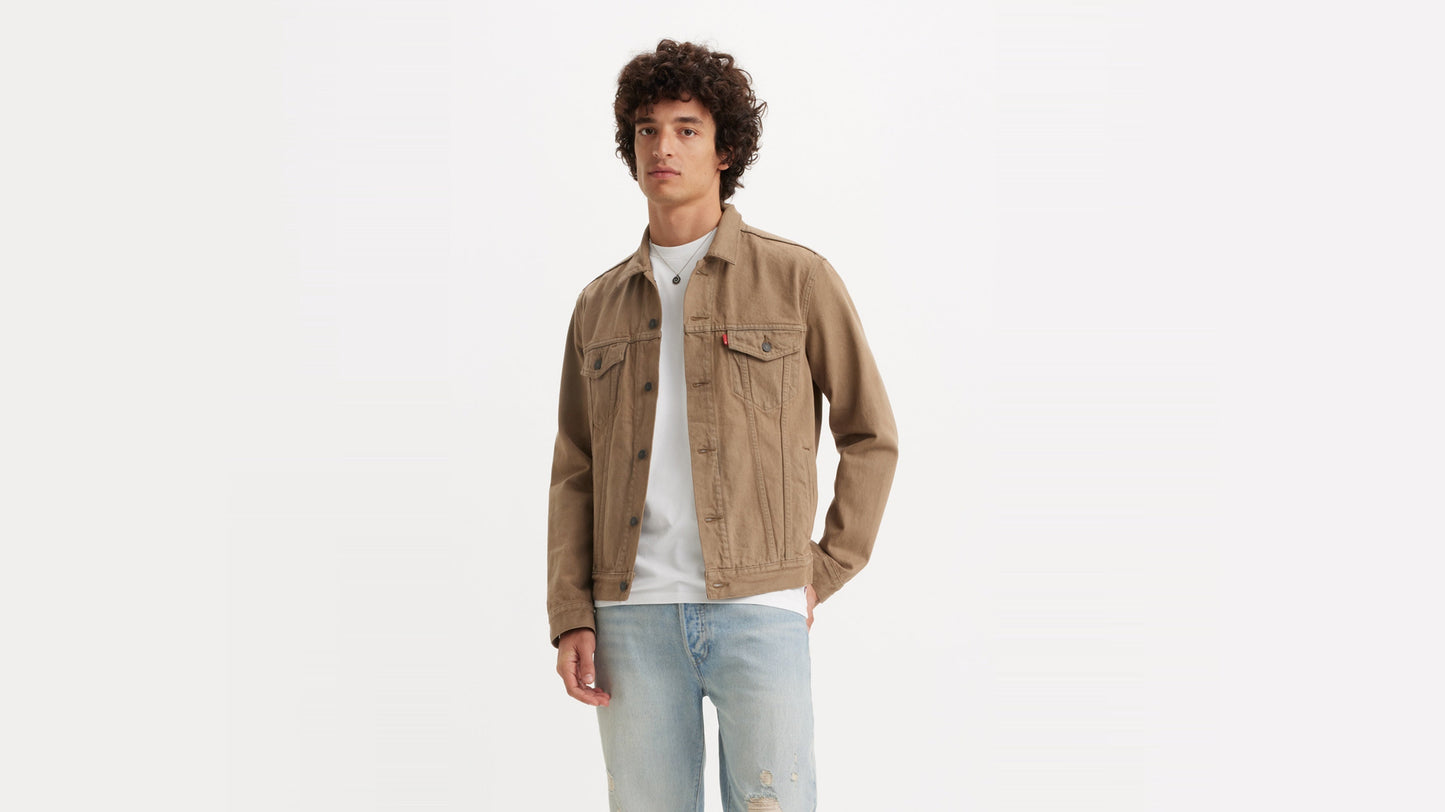 Model in Levi’s khaki trucker jacket layered over a white tee