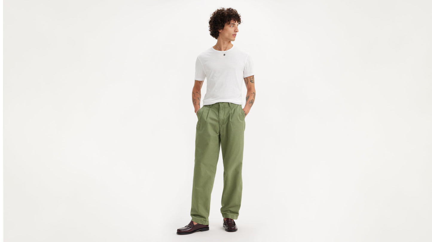Full-length view of man in white top and Chino Loose Straight Pleated Pants