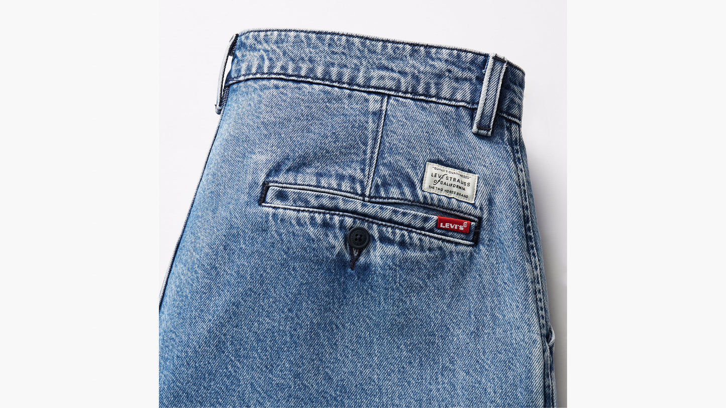 Close-up of Levi’s light blue Chino Loose Straight Pleated Pants back pocket with red logo tag