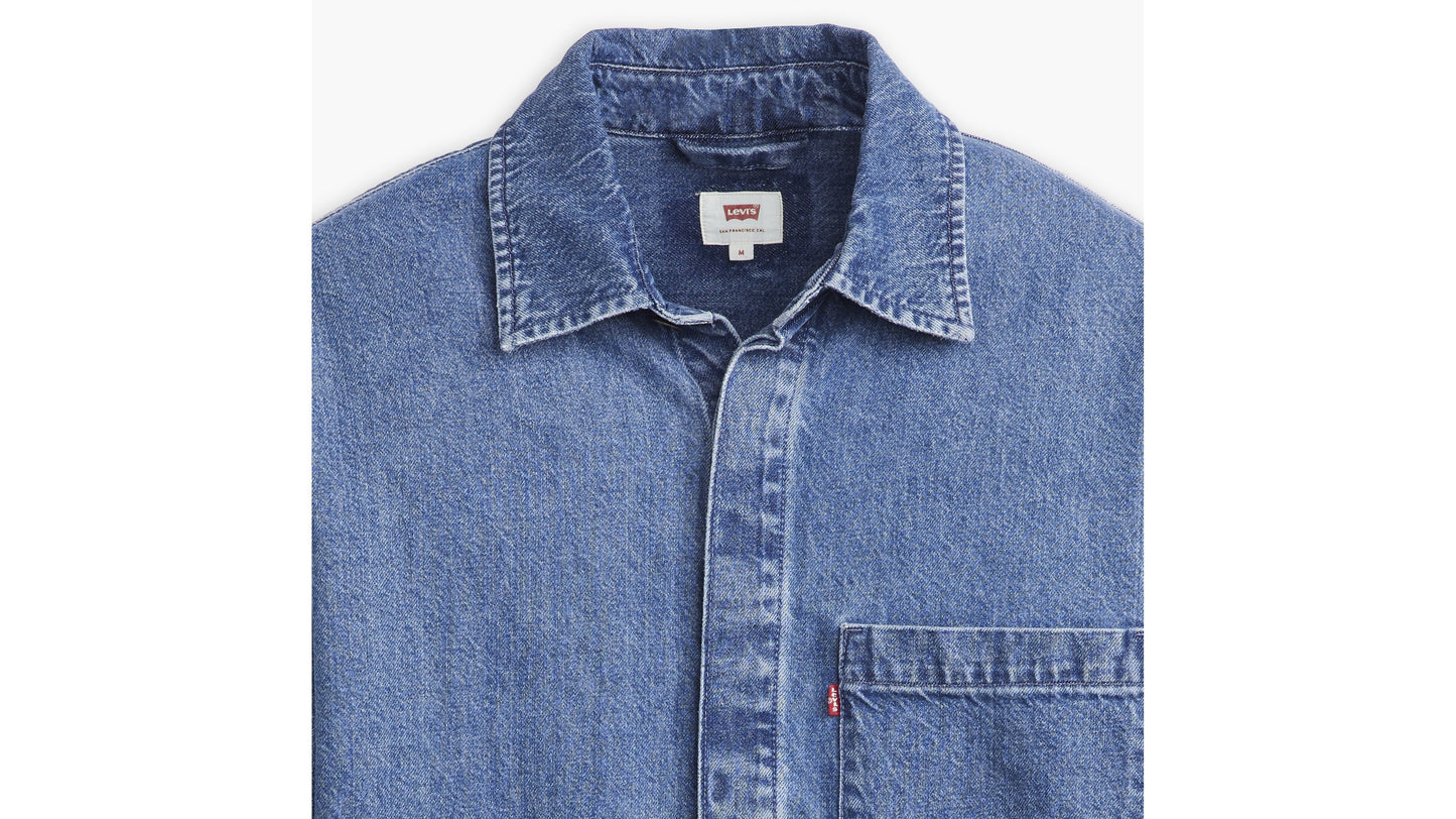 Close-up of Levi’s denim shirt collar, chest pocket and red tab branding