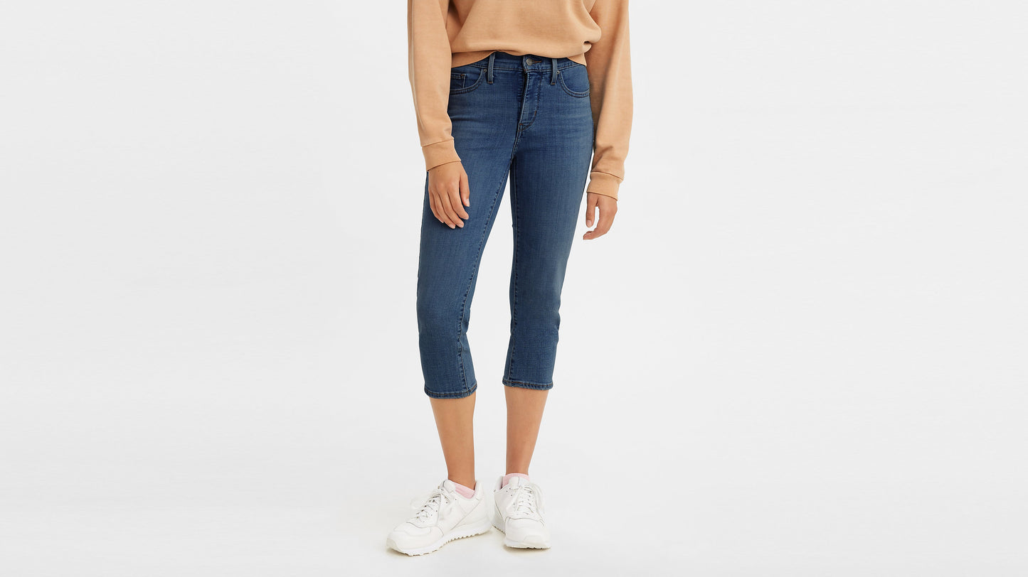 Close-up of Levi’s capri jeans with a tan sweatshirt