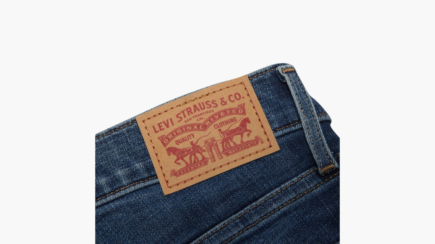 Detail of Levi’s two-horse logo patch on blue jeans