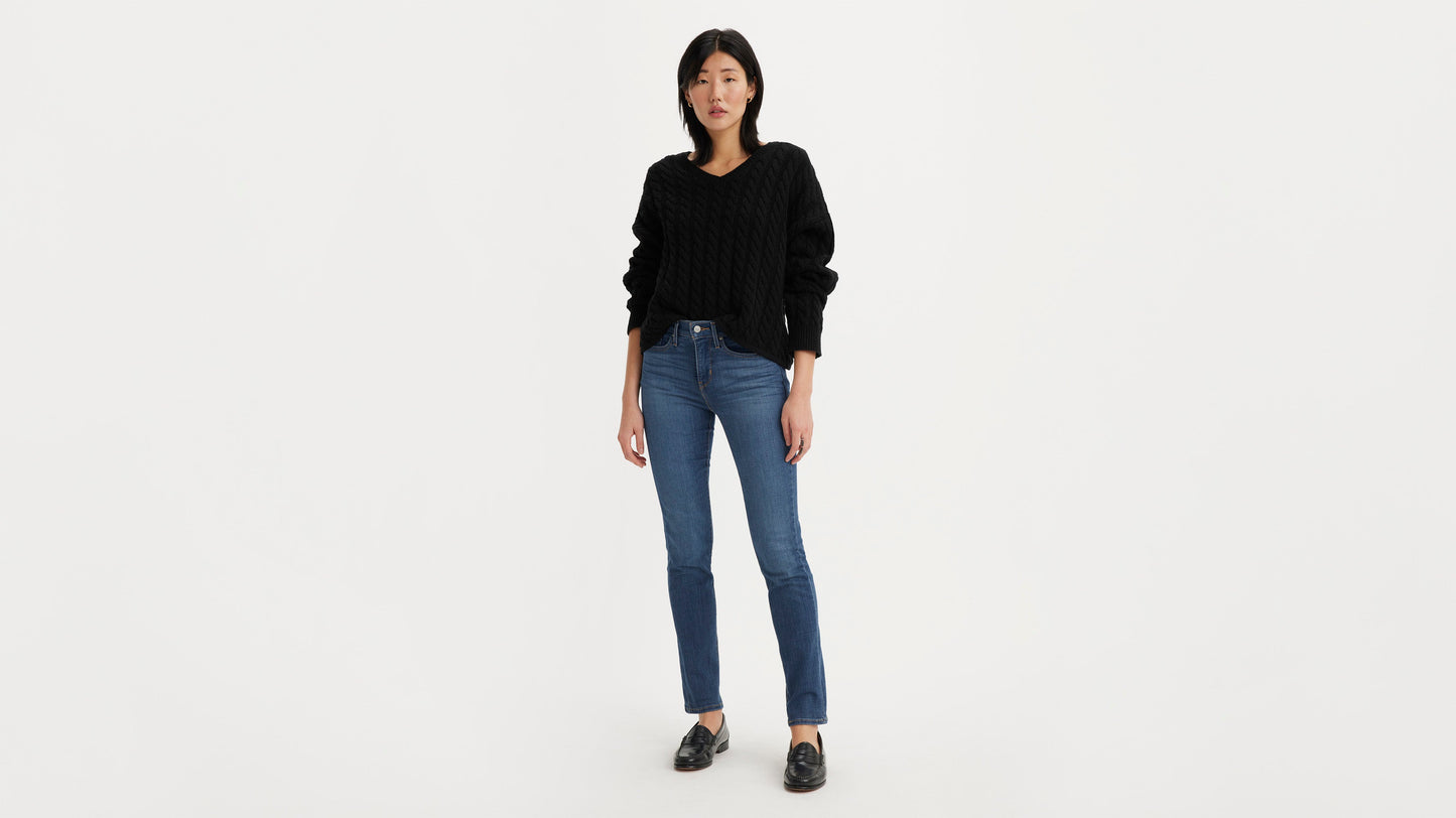 Woman in Levi’s 312 Shaping Slim Jeans in blue, front view, wearing black sweater