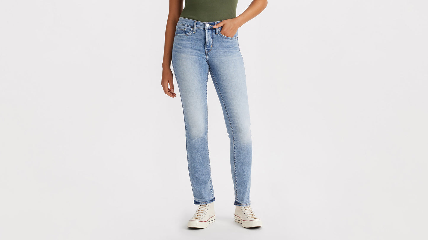 Cropped front view of a woman in light blue 314 straight jeans with sneakers