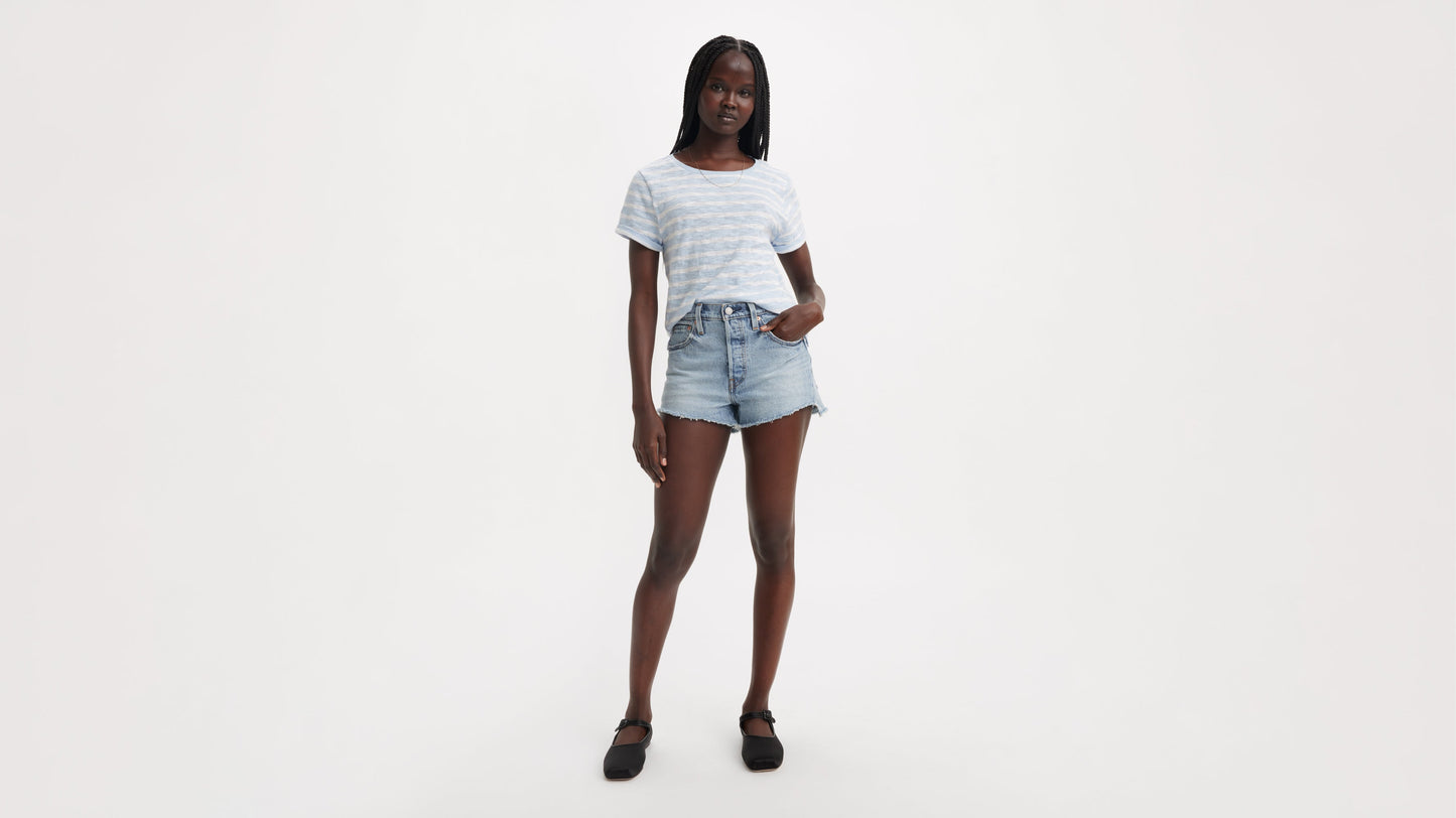Front view of Levi's 501 Shorts in light blue with striped tee and flats