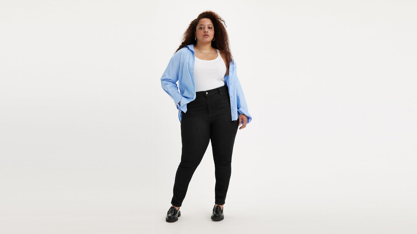 Woman in black Levi's high rise plus size skinny jeans and shirt