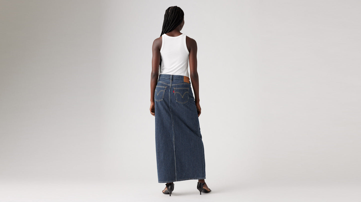 Back view of a woman in striped Levi's Column Skirt with white top