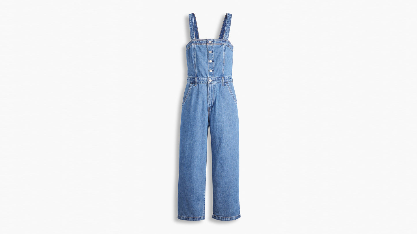 Front view of denim jumpsuit laid flat