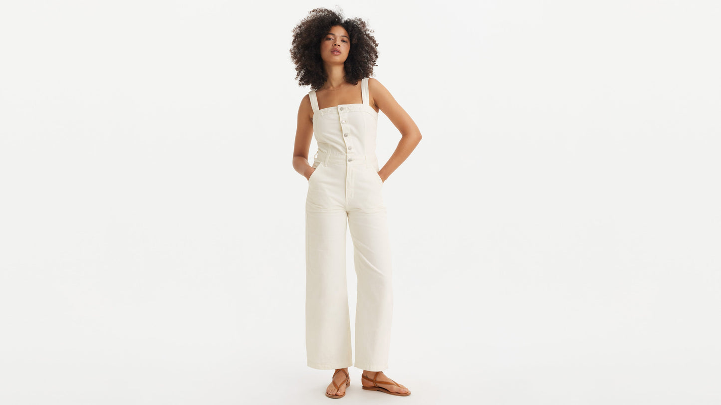 Woman in white Levi’s button-front jumpsuit