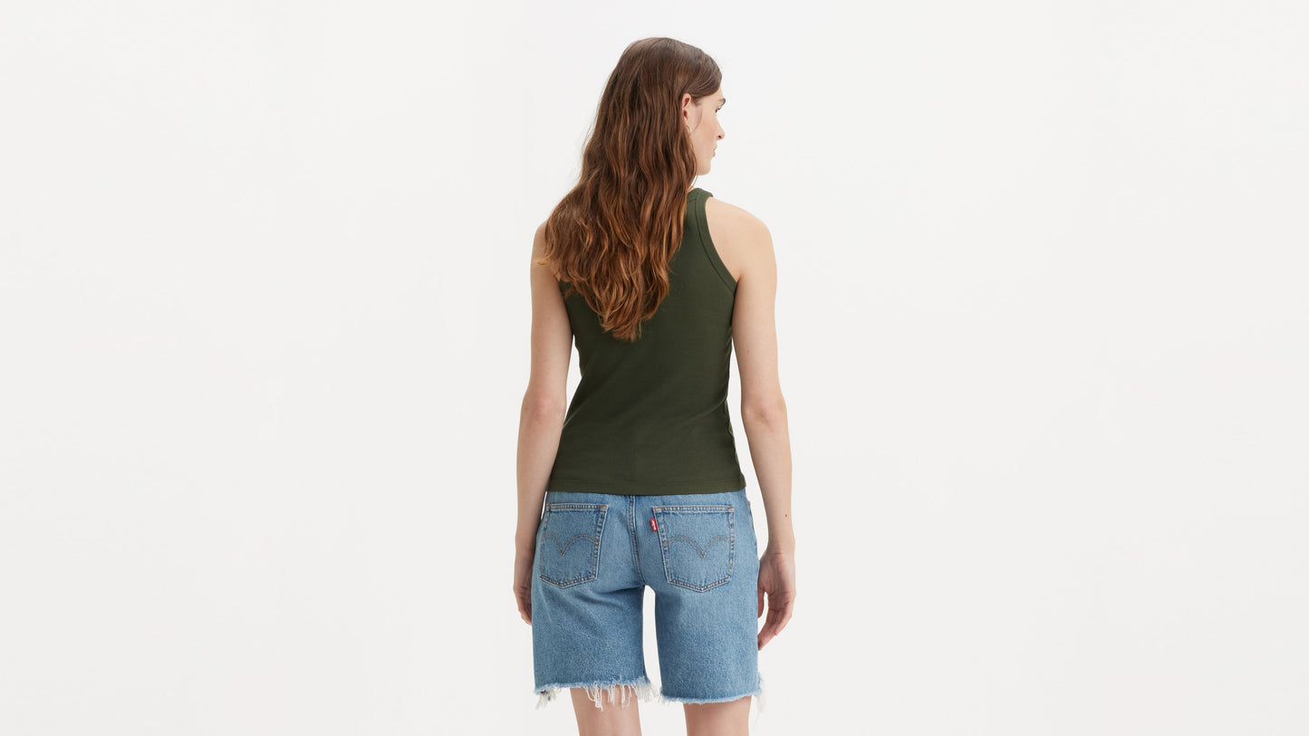 Back view of model wearing Levi’s cut-off shorts and tank