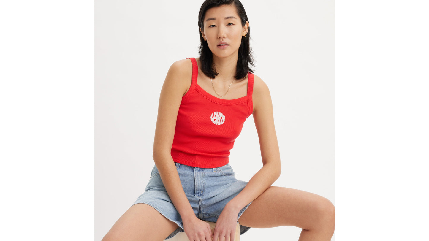 Woman in red Levi's tank top and denim shorts