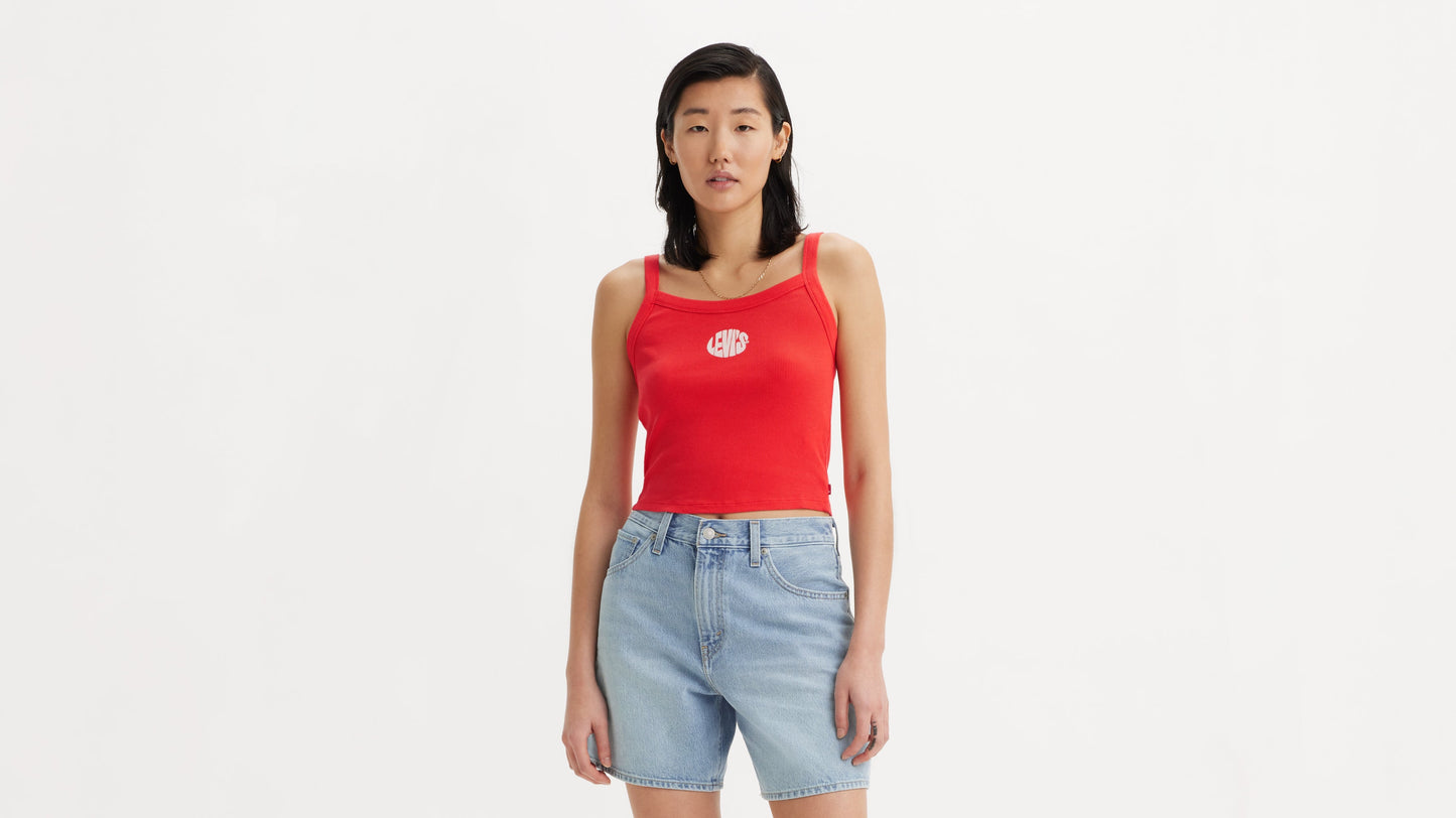 Woman wearing red Levi's tank and denim shorts