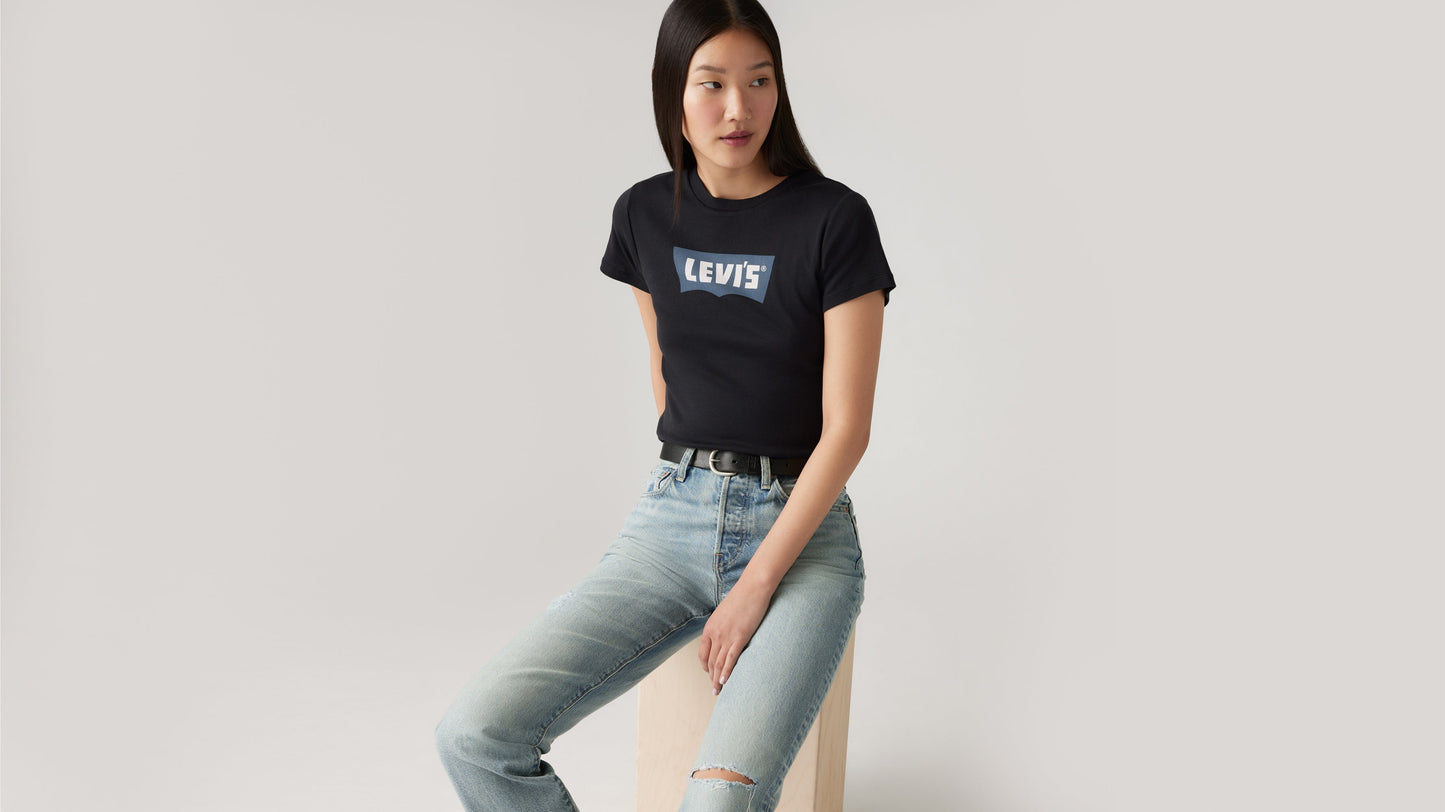Black Levi's graphic tee paired with light denim jeans