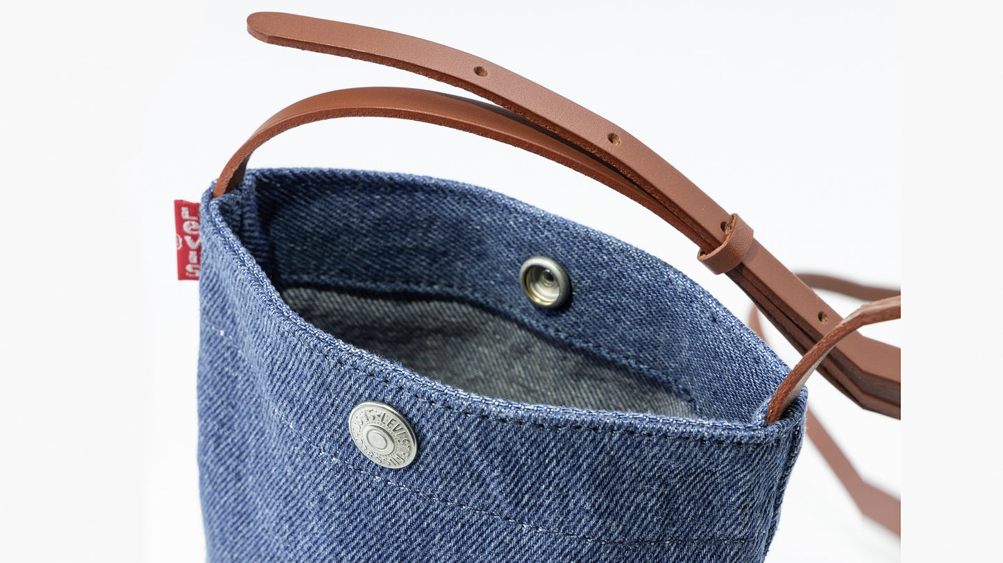 Close-up of Levi’s denim pouch with leather strap