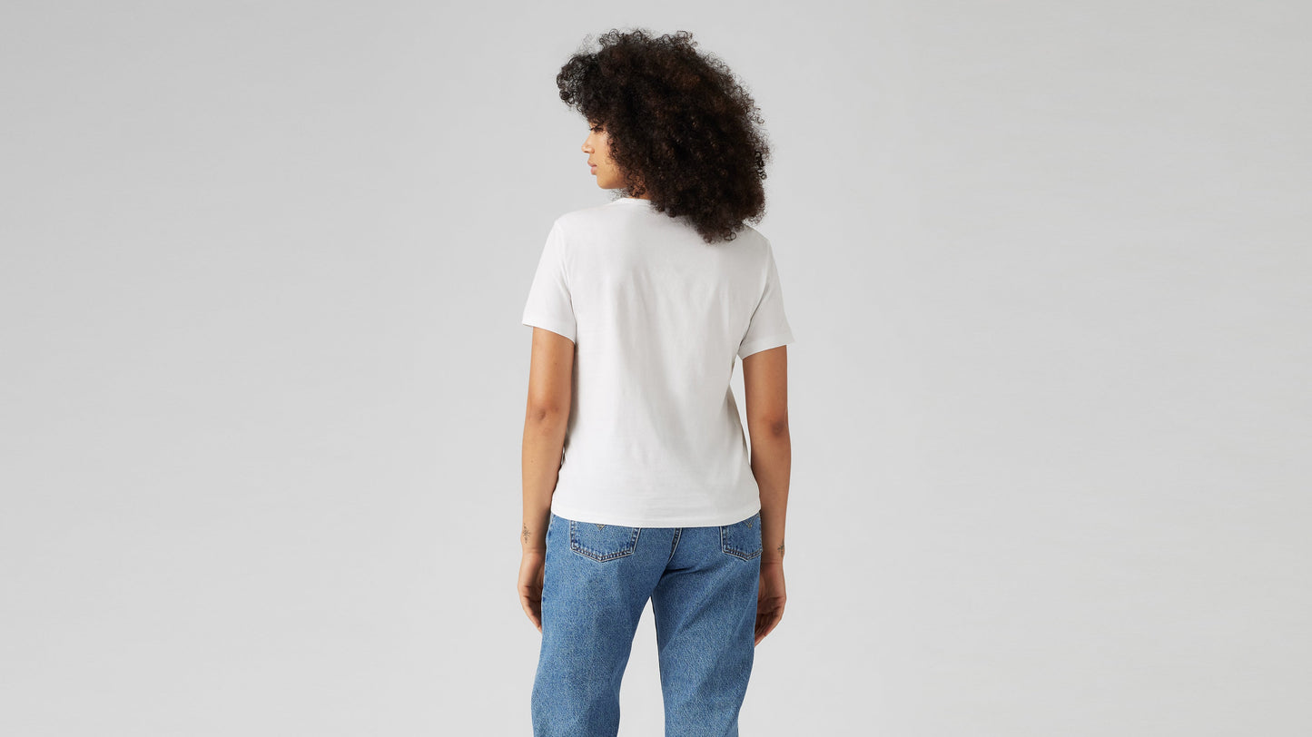 Woman wearing white Levi's t-shirt and blue jeans, back view