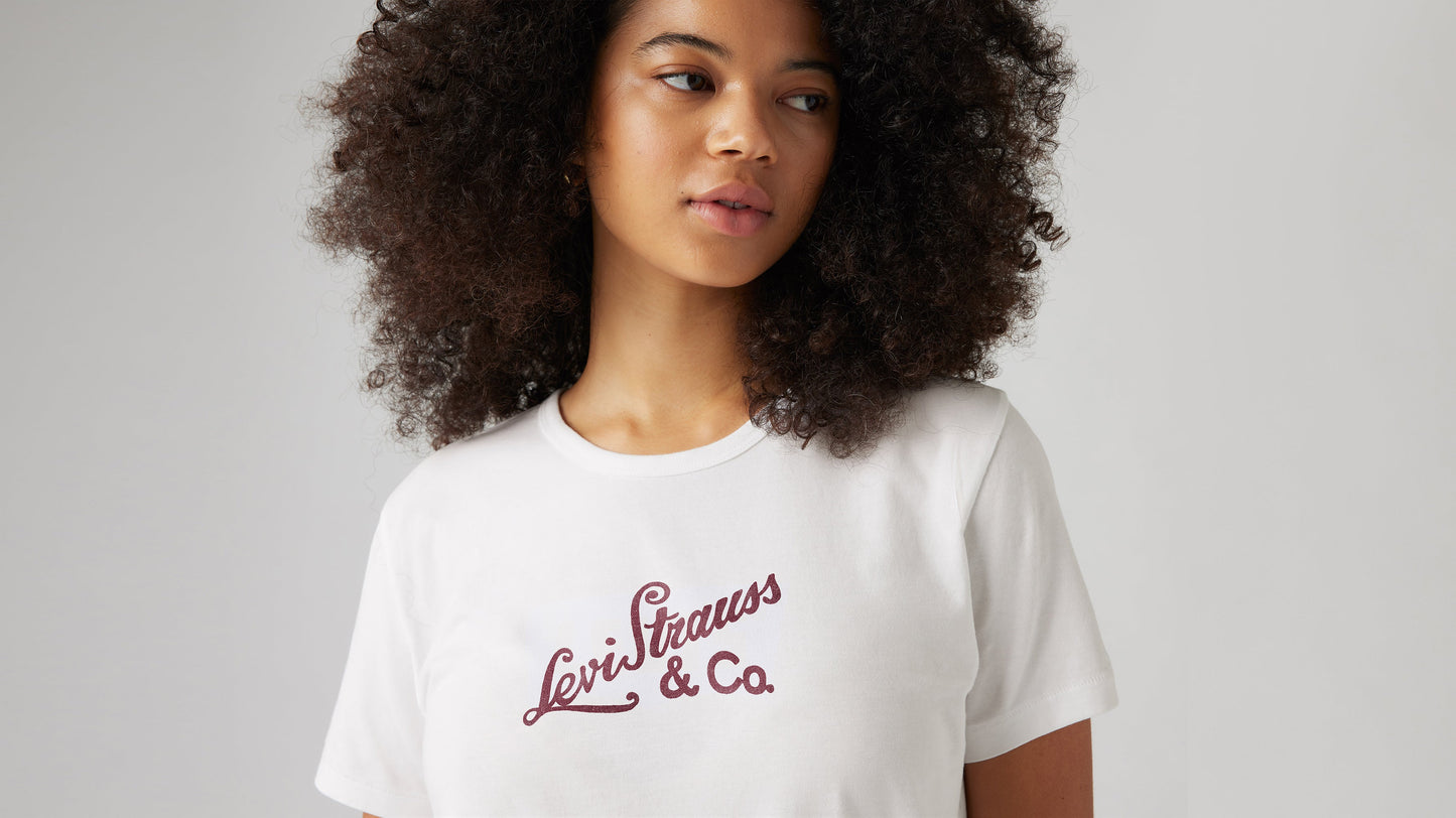 Woman wearing a white Levi's t-shirt with red script logo