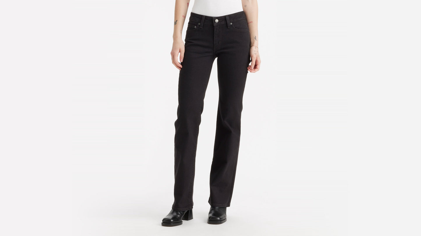 Front close-up view of Levi's Superlow Bootcut Jeans worn with black boots