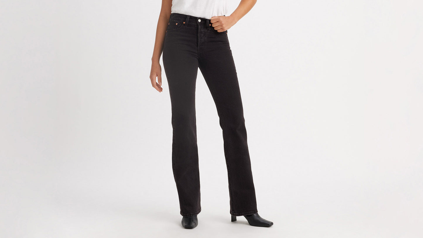 Cropped front view of a woman in black Levi's Wedgie Jeans, & boots