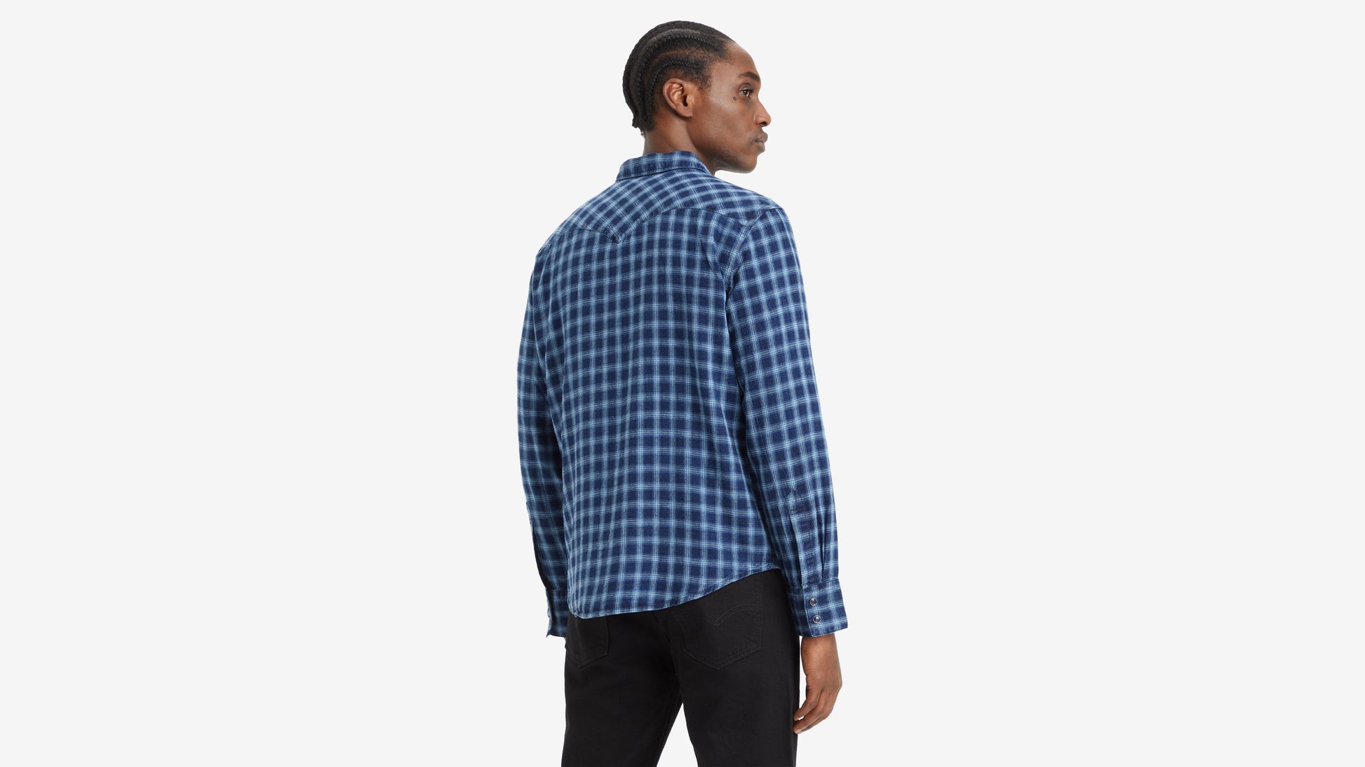 Man facing sideways in blue plaid shirt