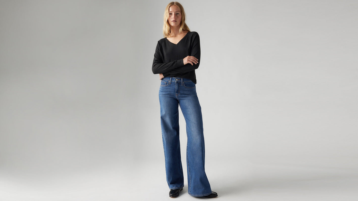 Model wearing Levi's women's jeans, angled front view