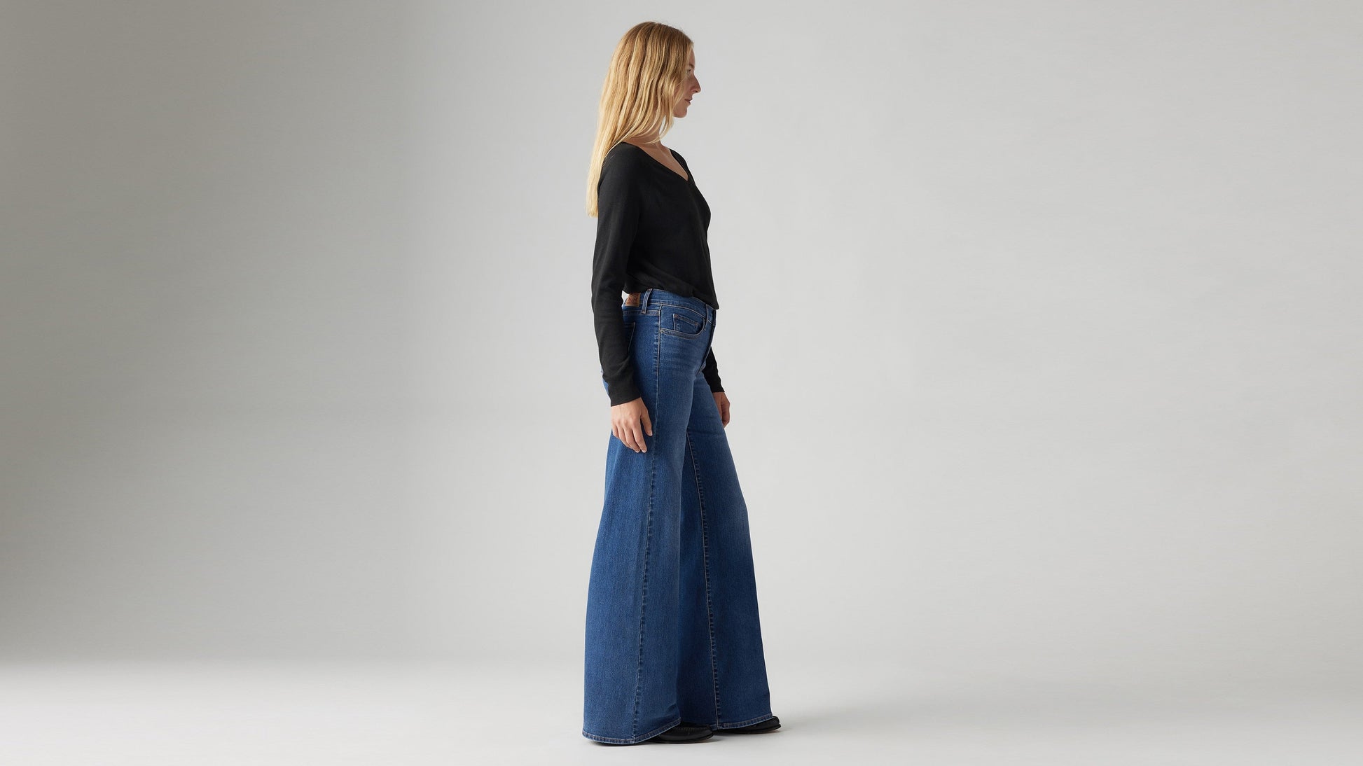 Model wearing Levi's women's jeans, side view